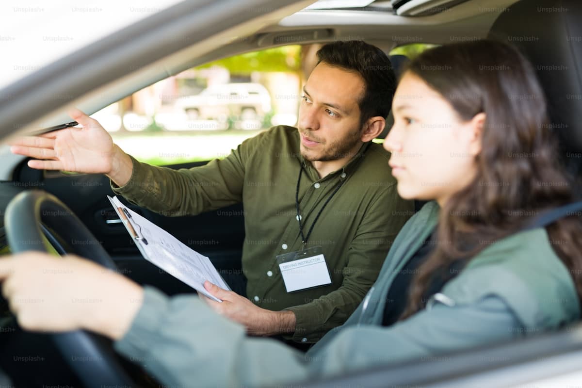Professional driving school instructor smiling