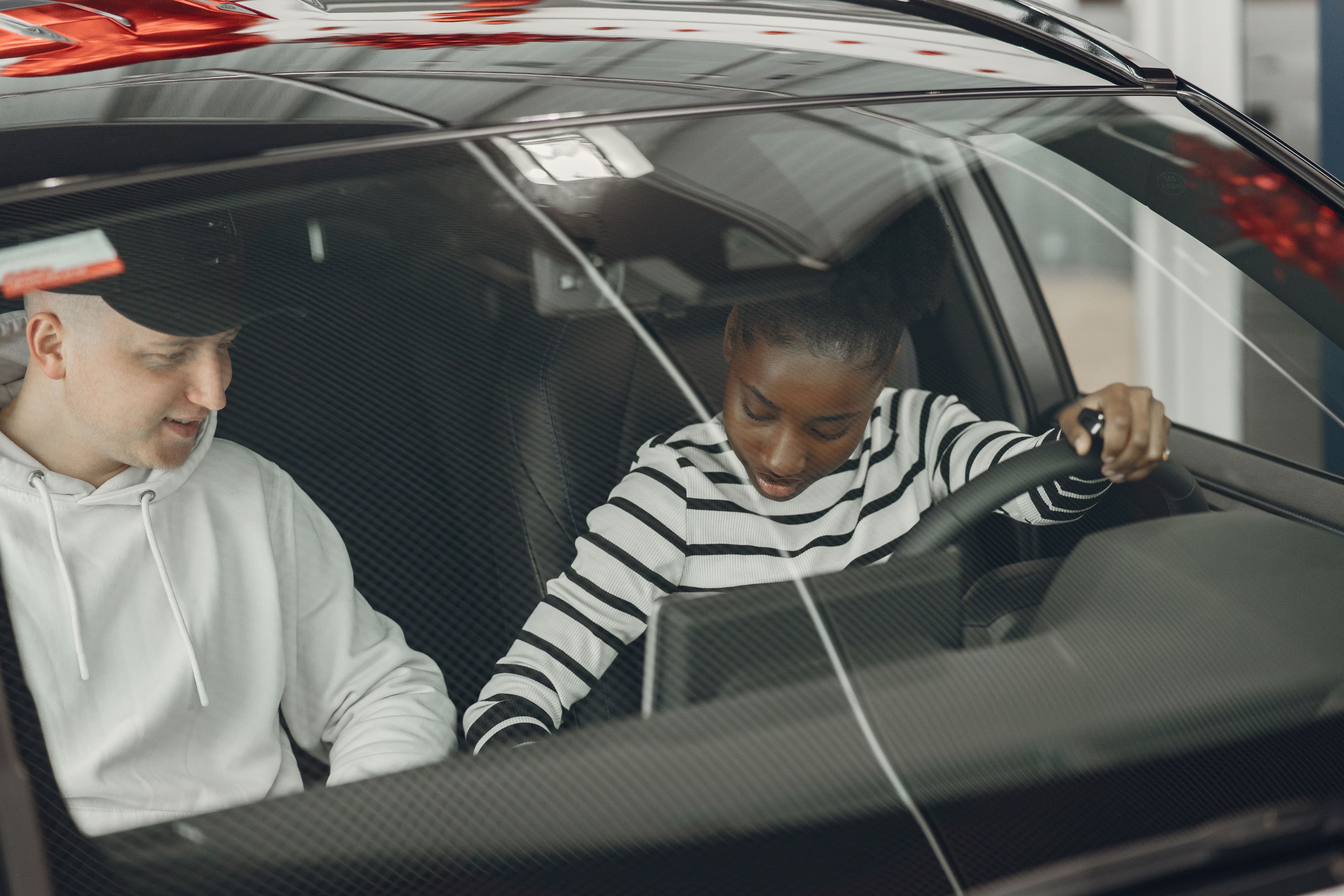 Student learning to drive with certified instructor